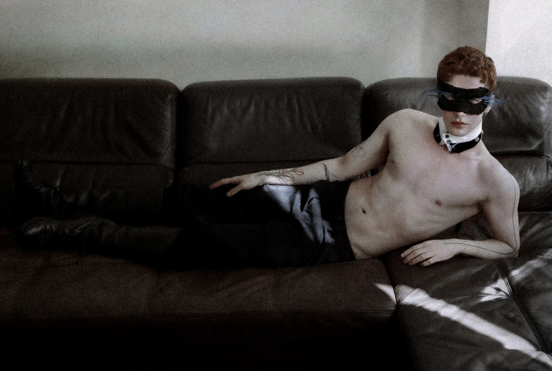 Roman reclining in his own mask and collar
